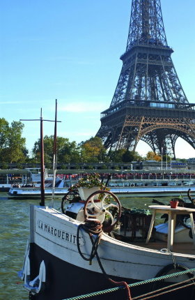 Paris cruises pass along the Eiffel Tower